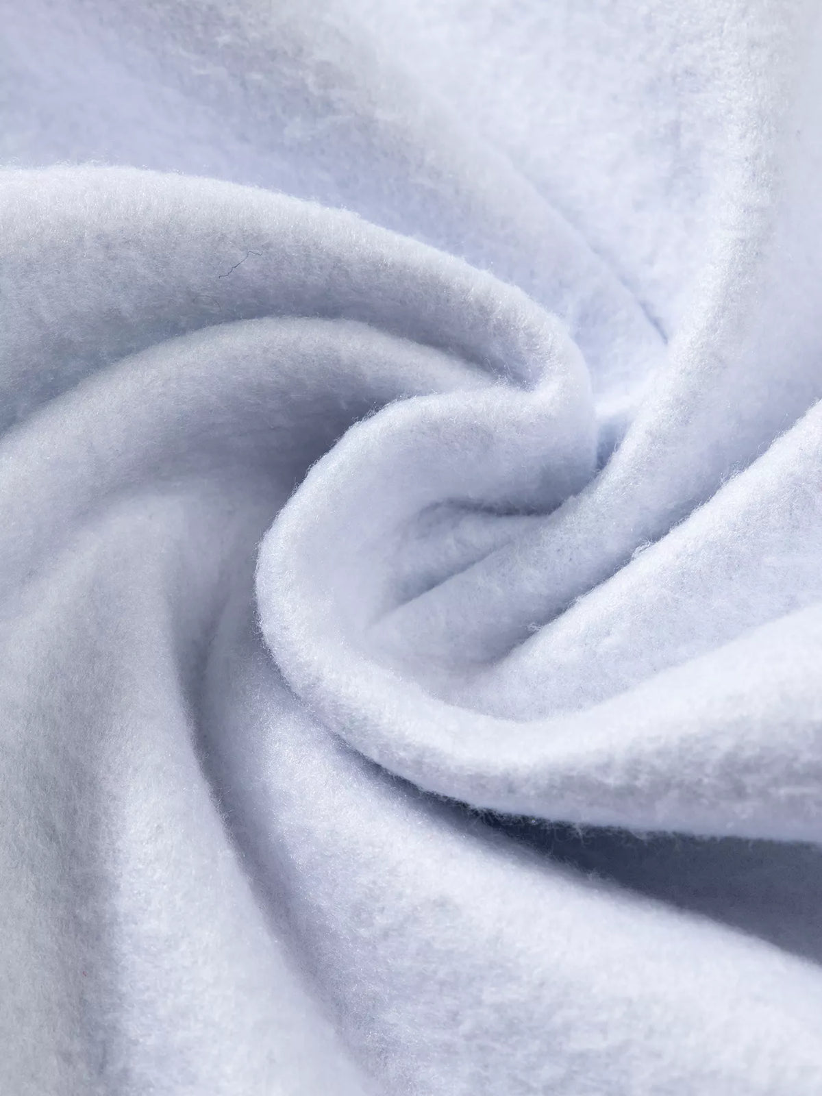 Fabric close-up on light blue abstract print fuzzy collar tunic jacket