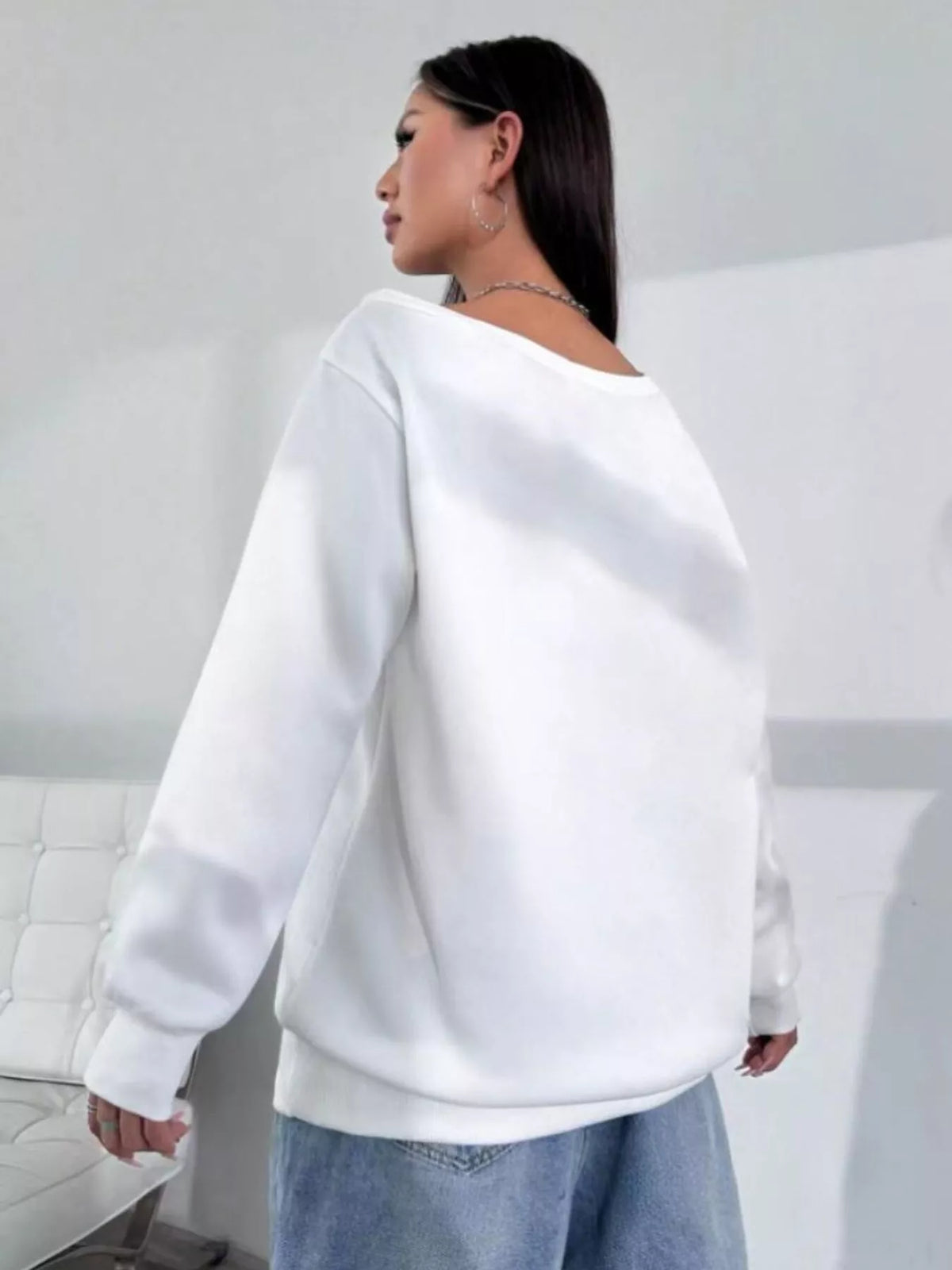 White asymmetric-neck sweatshirt, back view