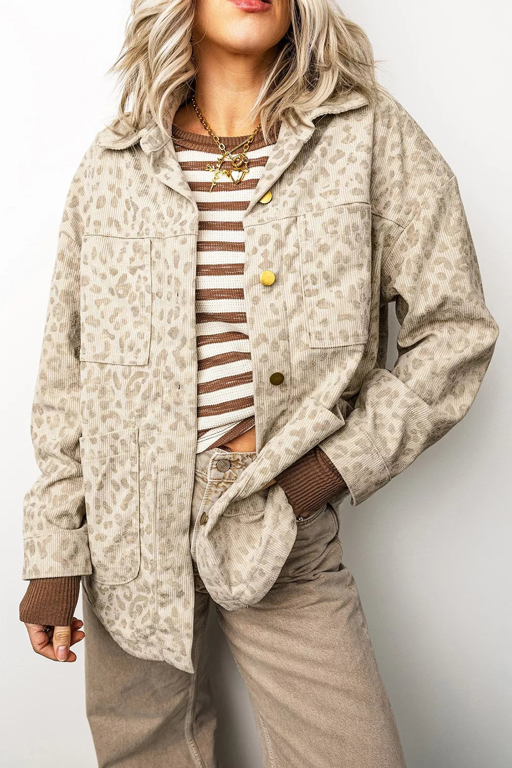 Beige leopard corduroy button-front jacket, front view.