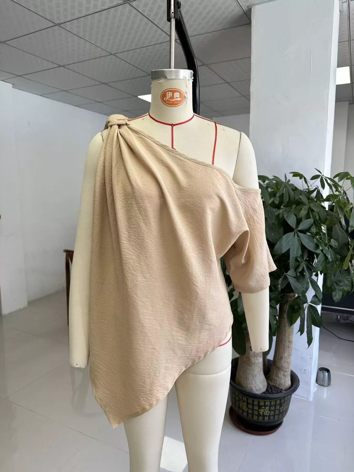 One-Shoulder Knot Detail Blouse in beige, dress form front view