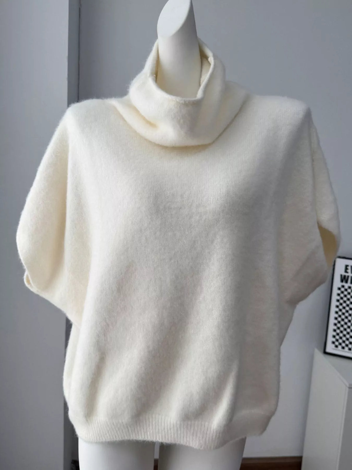 Fuzzy short-sleeve turtleneck sweater in cream, front mannequin view