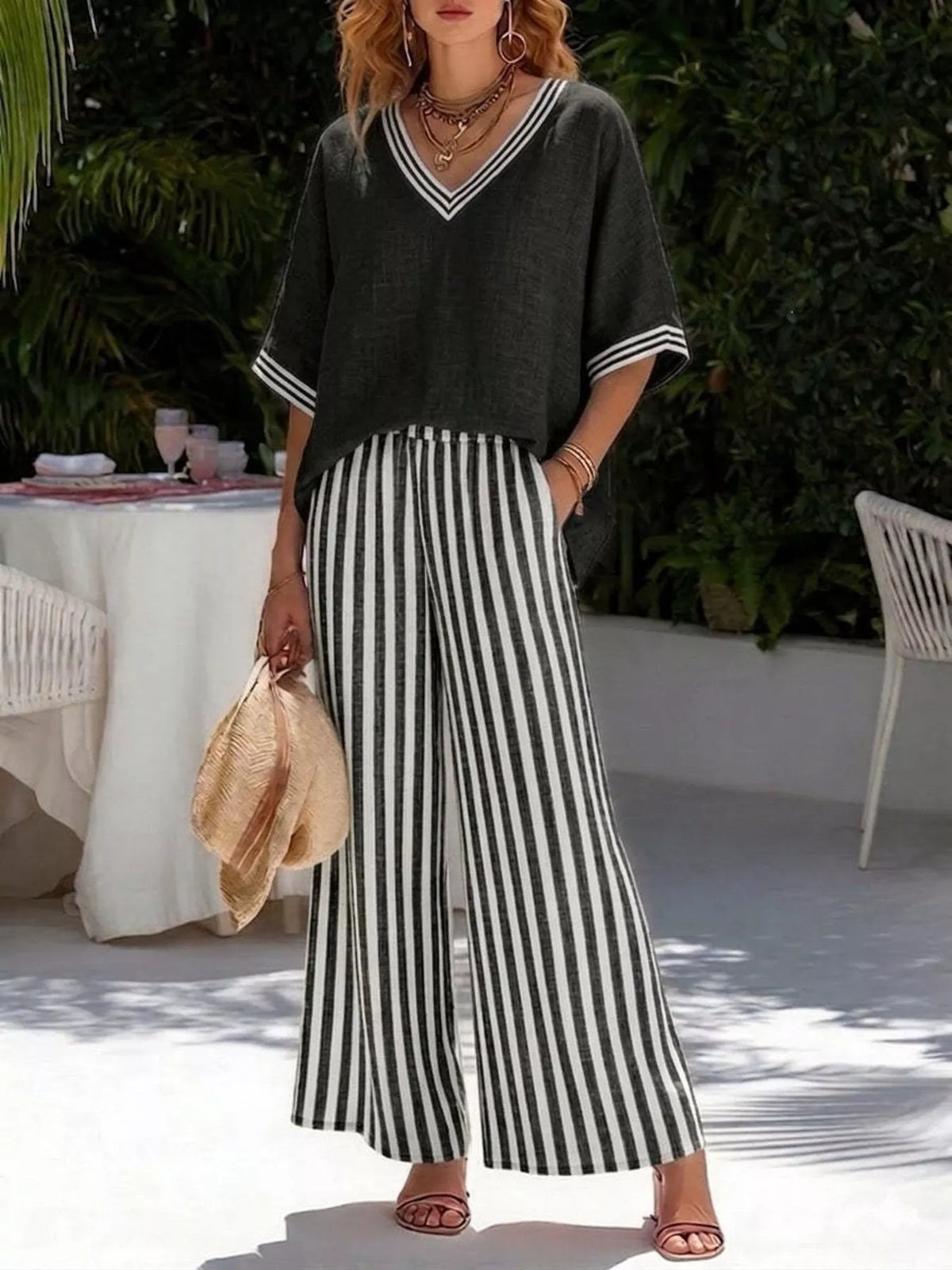 Black v-neck striped top and pants two-piece set — front view