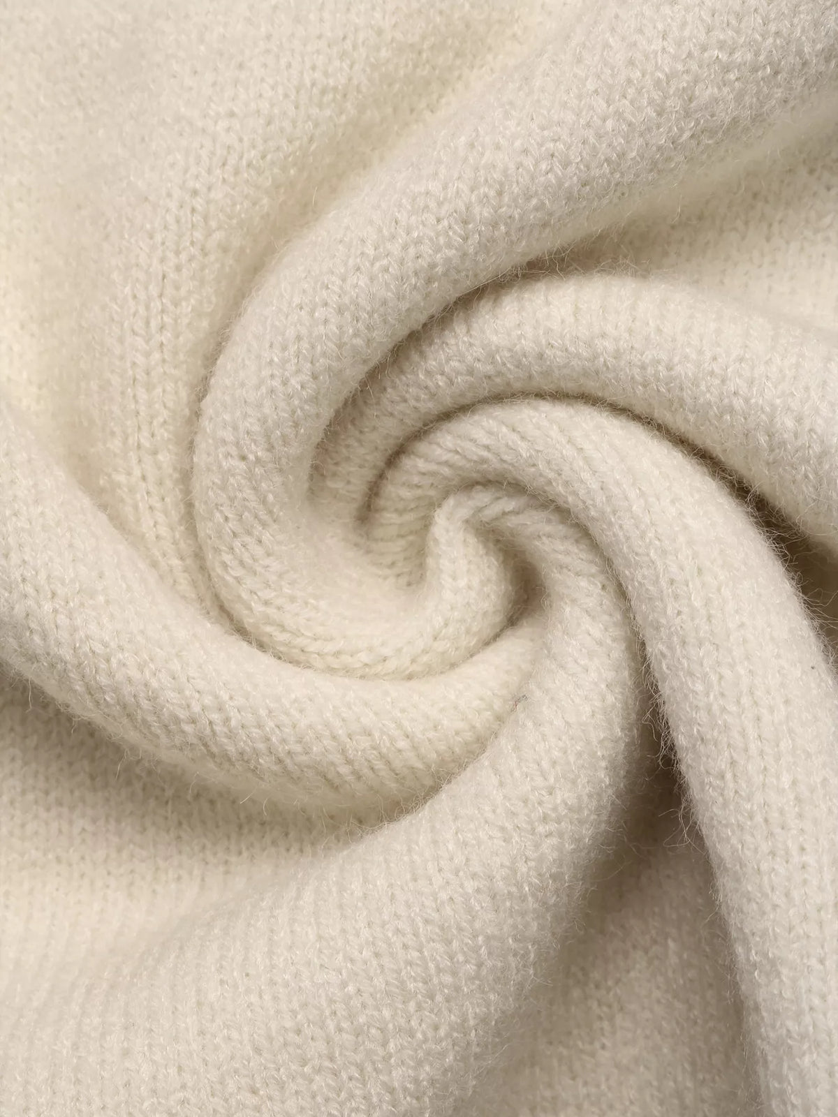 Cream heart-patterned crew neck sweater, knit fabric close-up