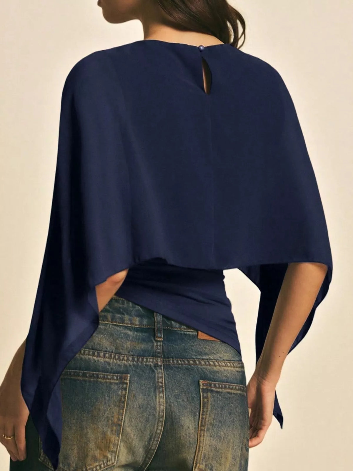 Navy cape sleeve round neck blouse, back view