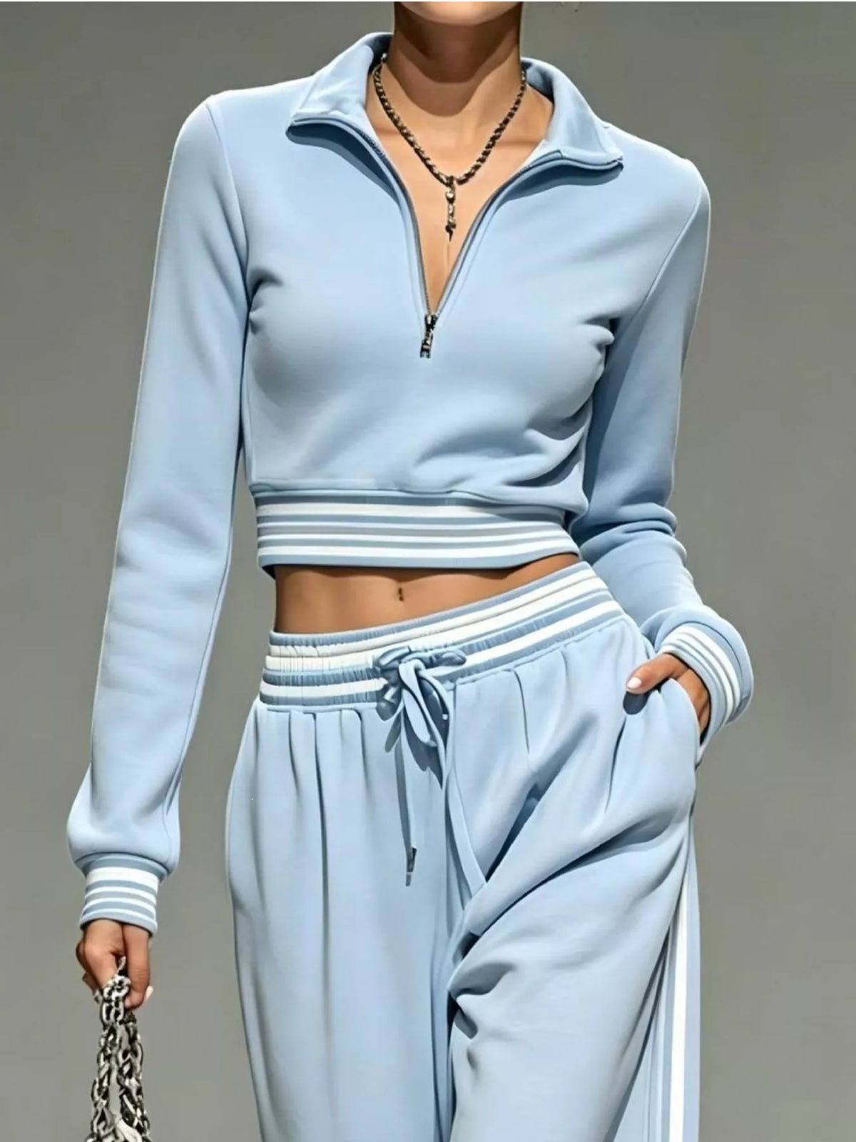 Blue half-zip crop top and pants set, zip neckline and waist detail