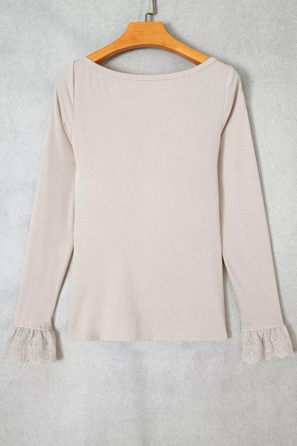Beige lace-cuff long sleeve top, back on hanger