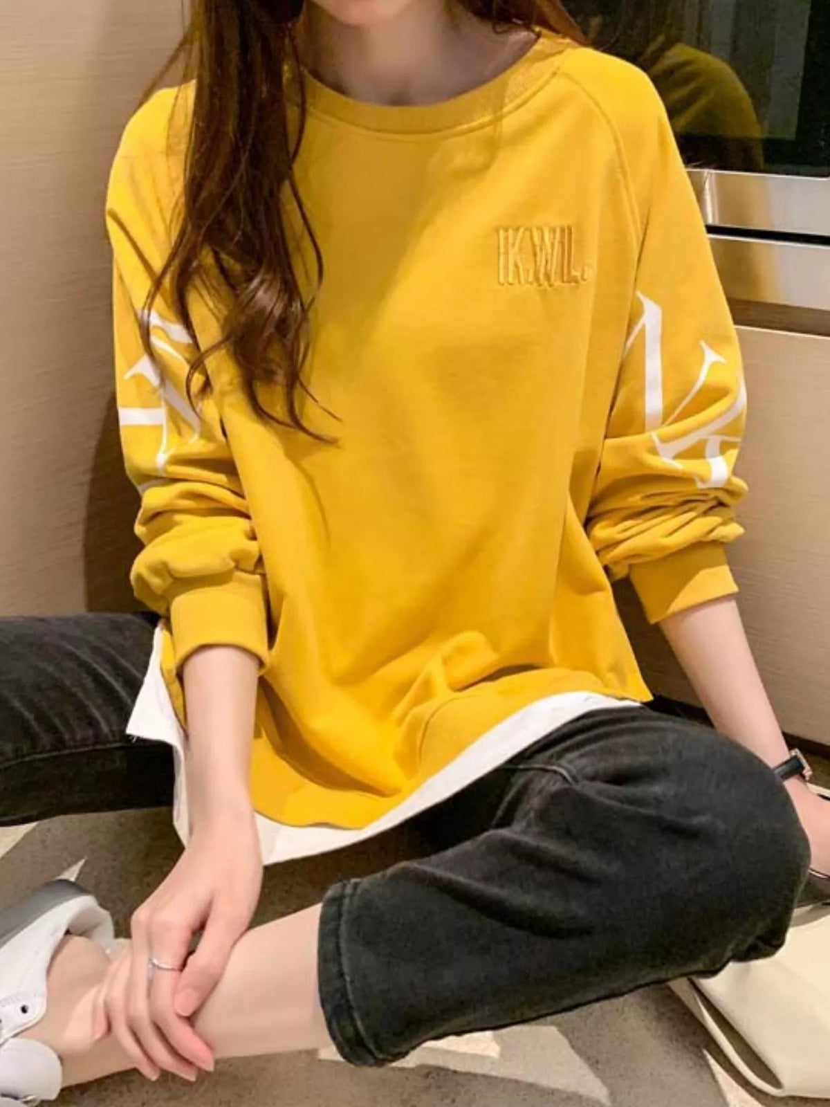 Yellow layered-hem sweatshirt with graphic sleeve detail