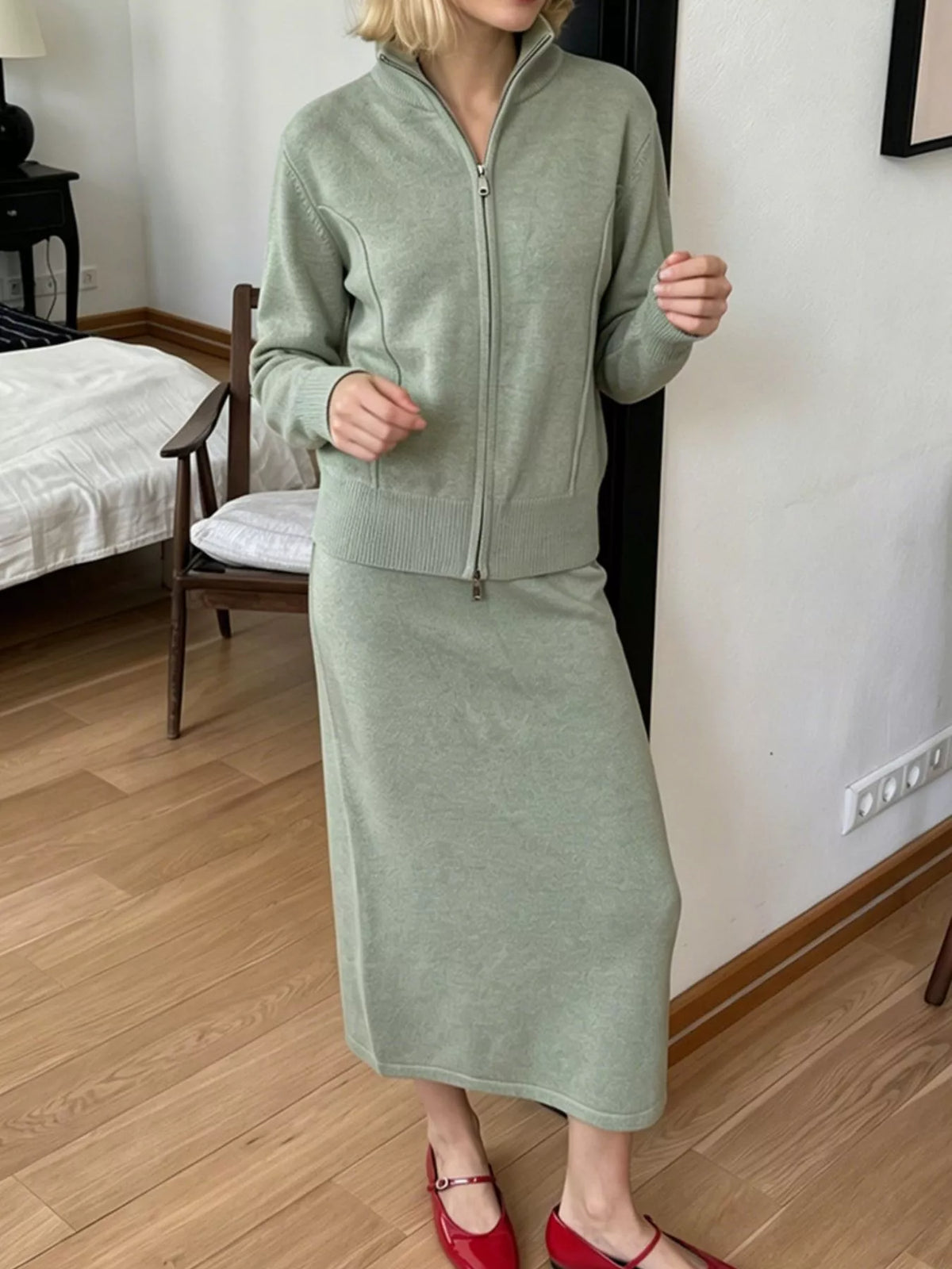 Zip-up cardigan and midi skirt knit set in sage green, raised-hands view