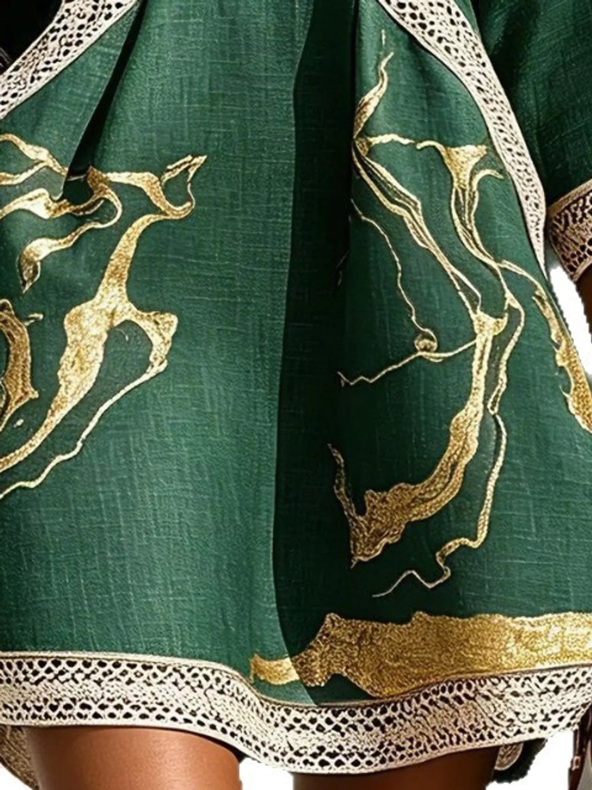Green notched 3/4 sleeve mini dress, close-up of the print and hem trim