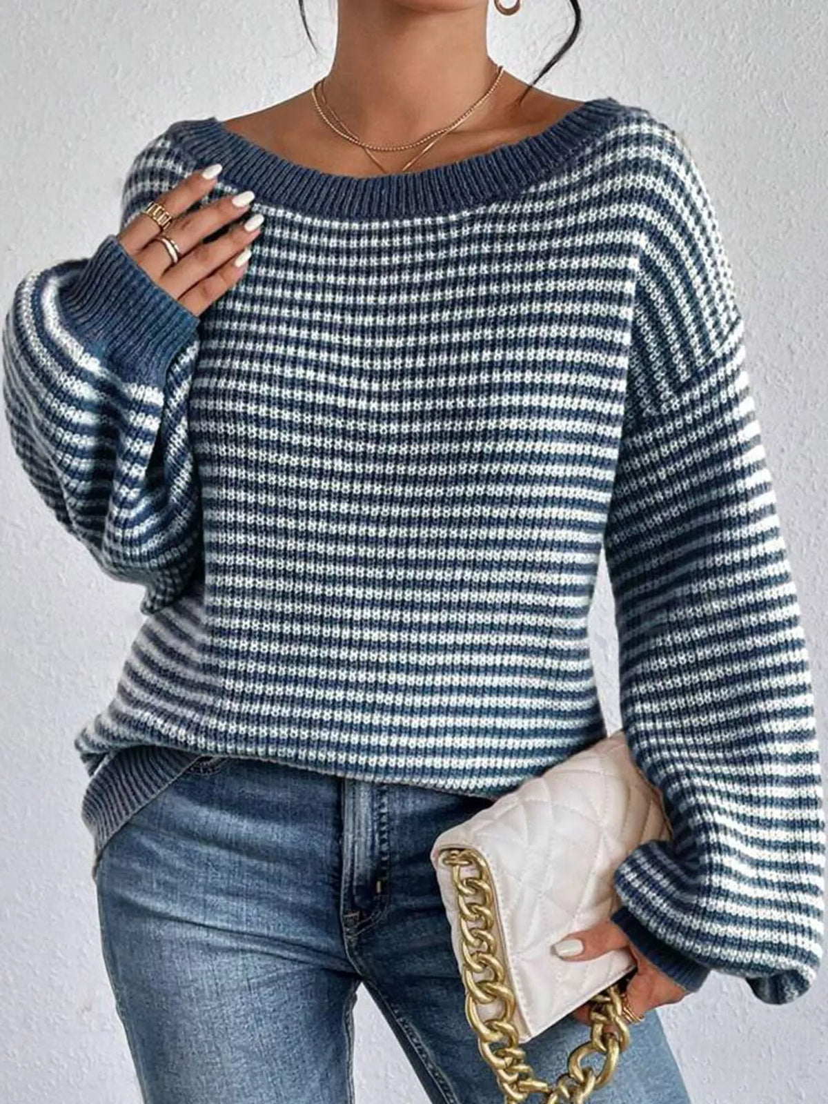 Blue and white striped knit boat neck sweater