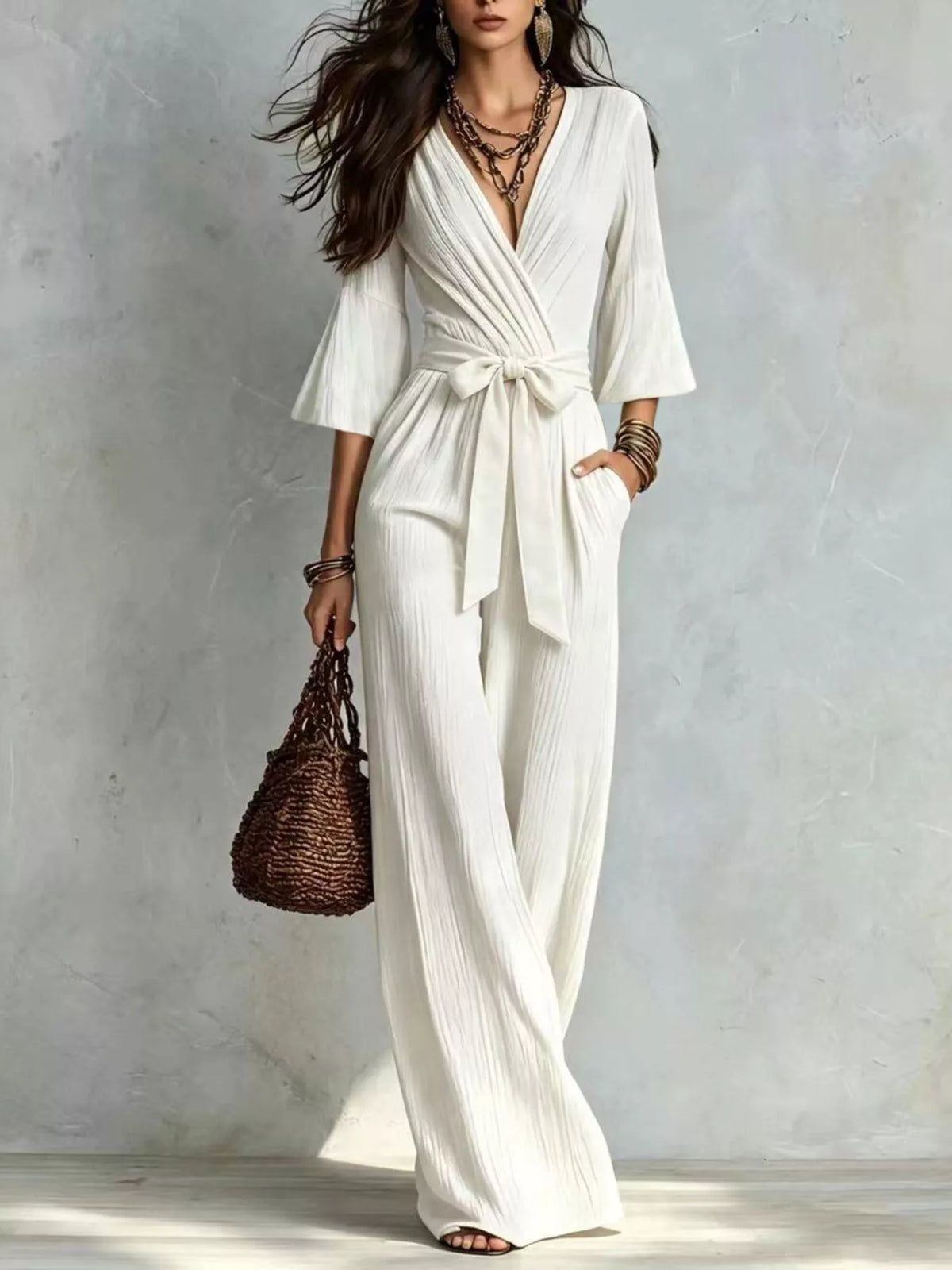 White pleated wide-leg jumpsuit with tie-waist