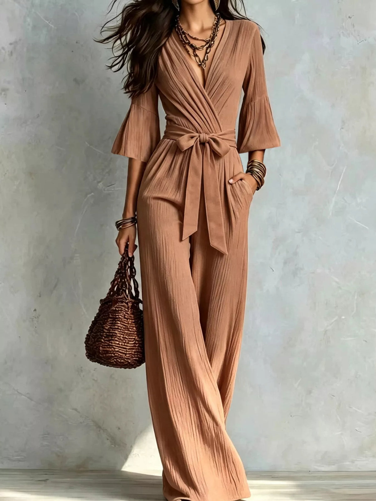 Brown pleated wide-leg jumpsuit with tie-waist