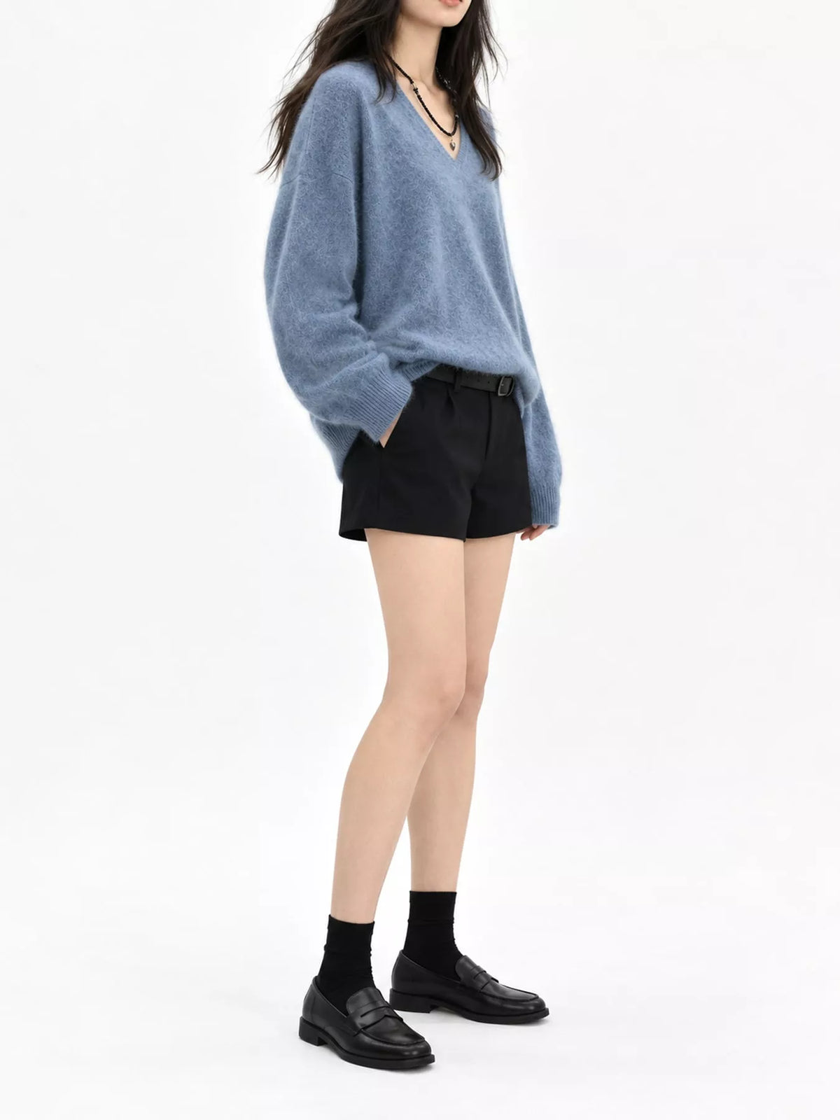 Blue v-neck sweater, side view