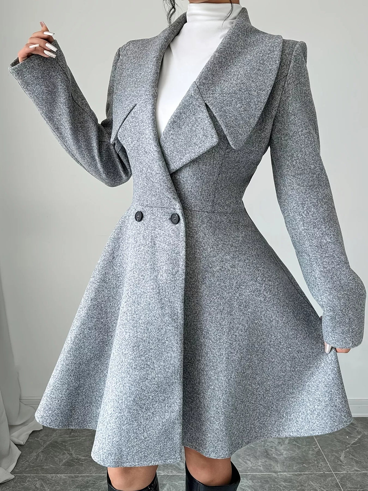 Gray double-breasted flared coat, front view with arm extended