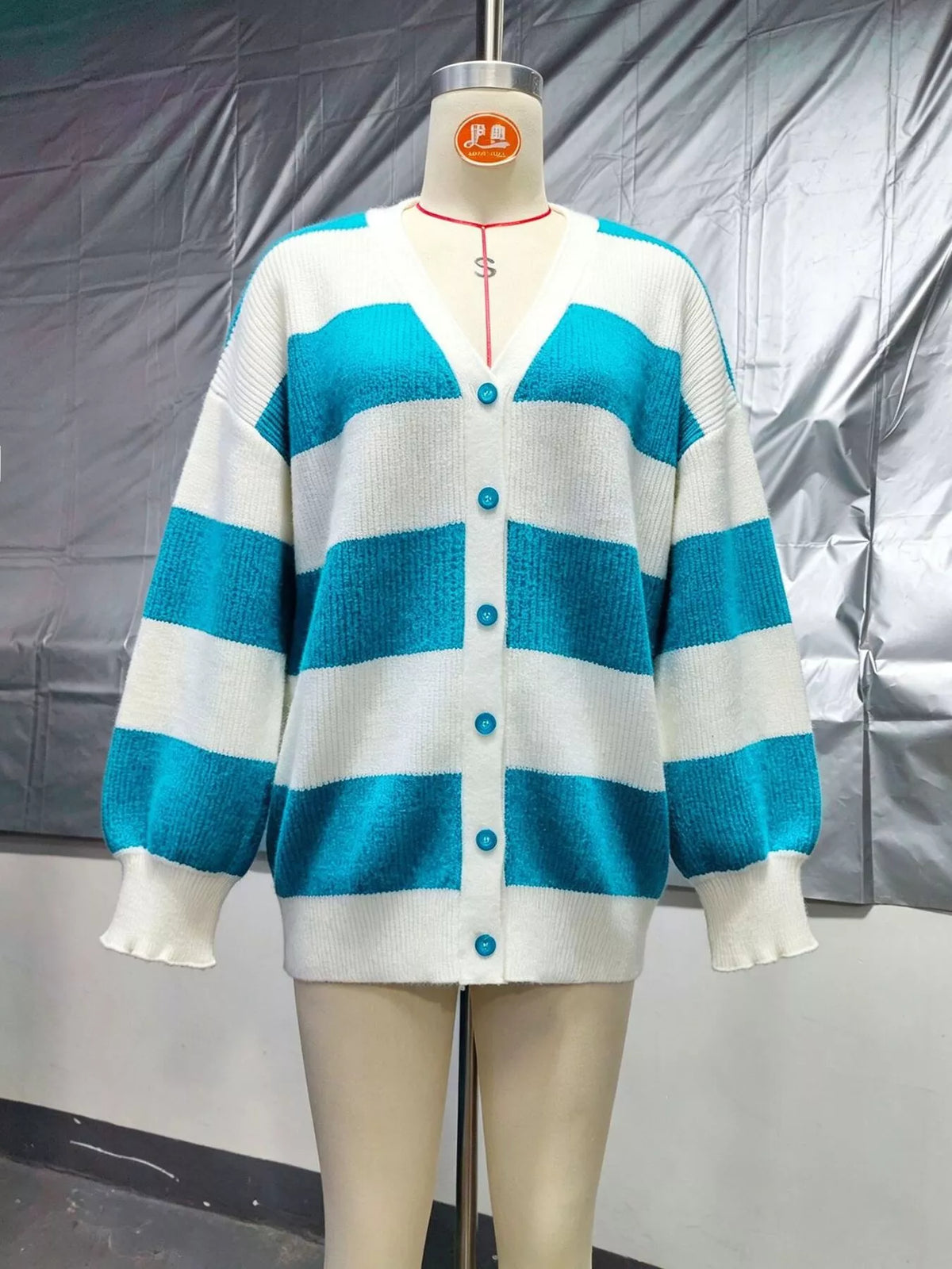 Striped cardigan, teal and white mannequin front