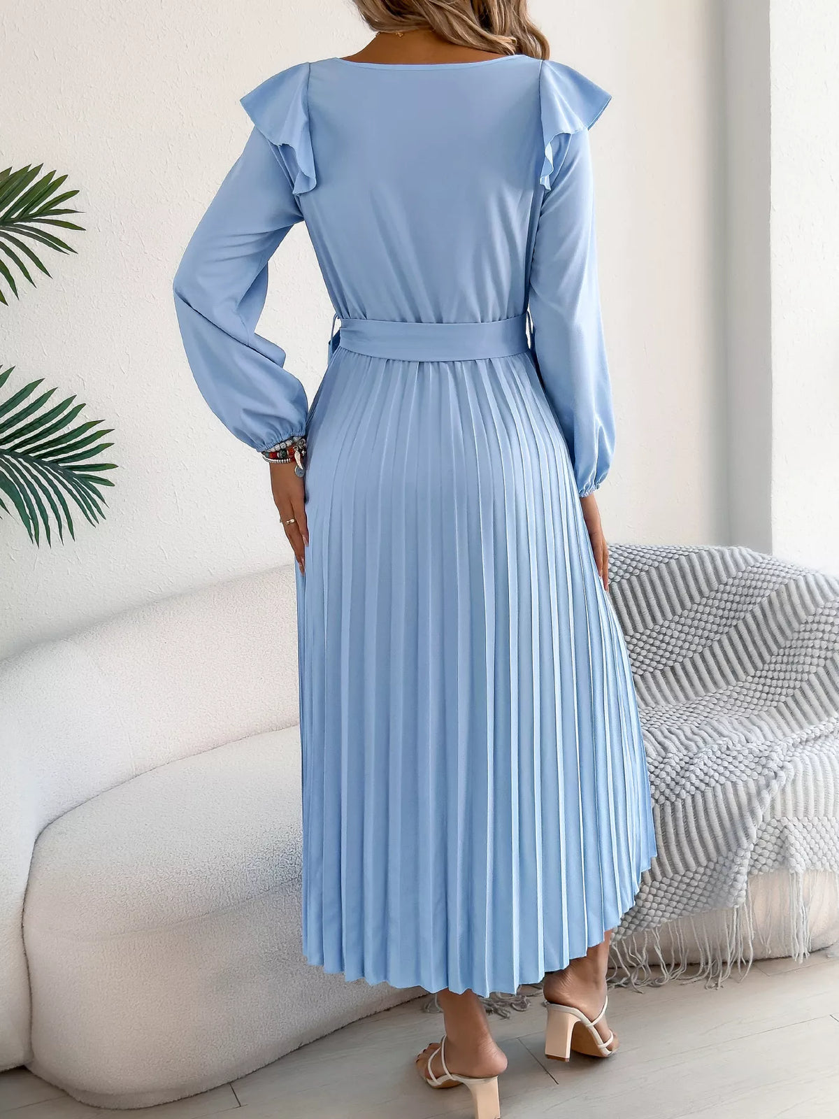 Blue ruffled pleated tie-waist midi dress, back view.
