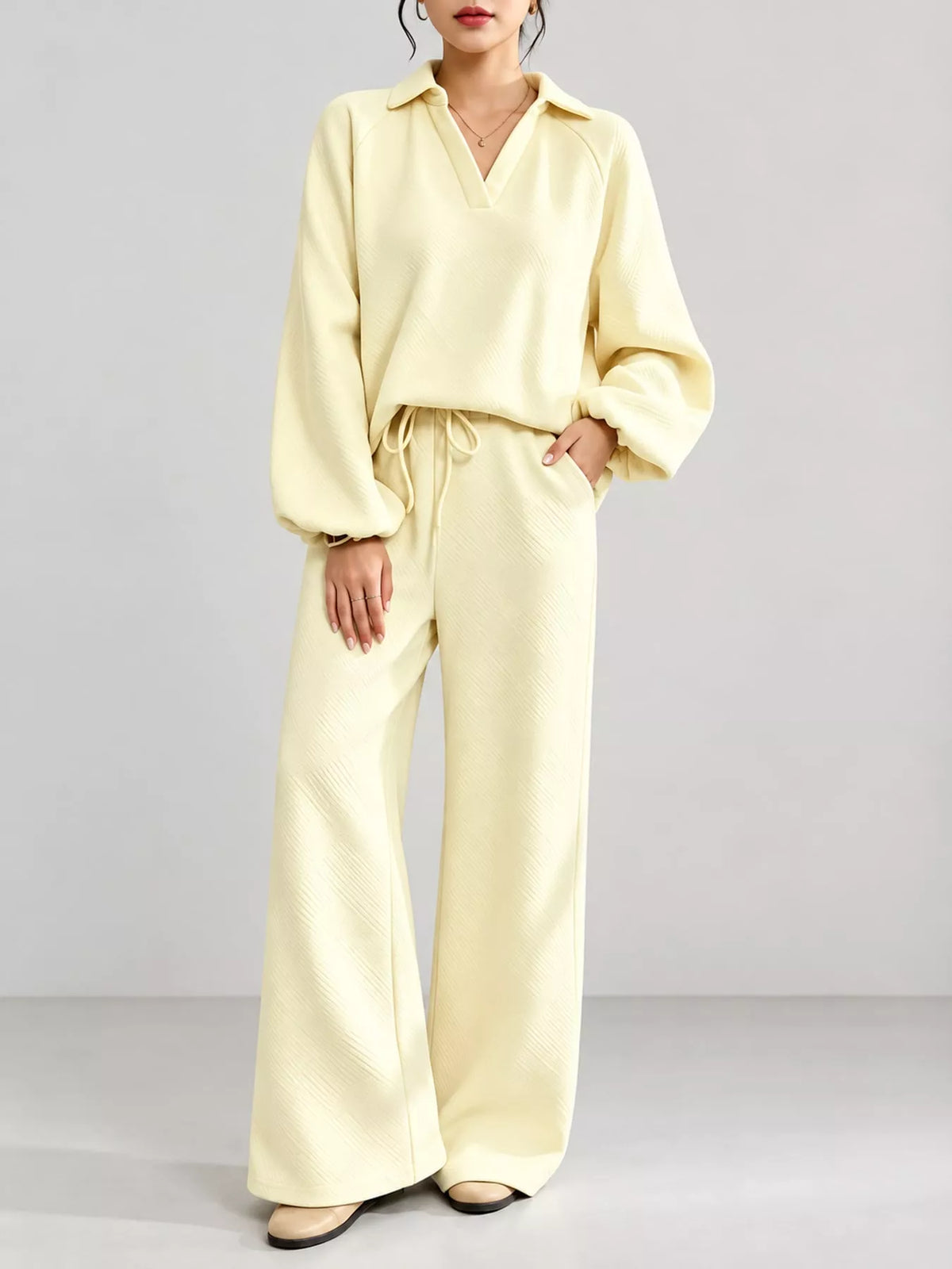 Yellow textured polo collar top and wide-leg pants set — front view