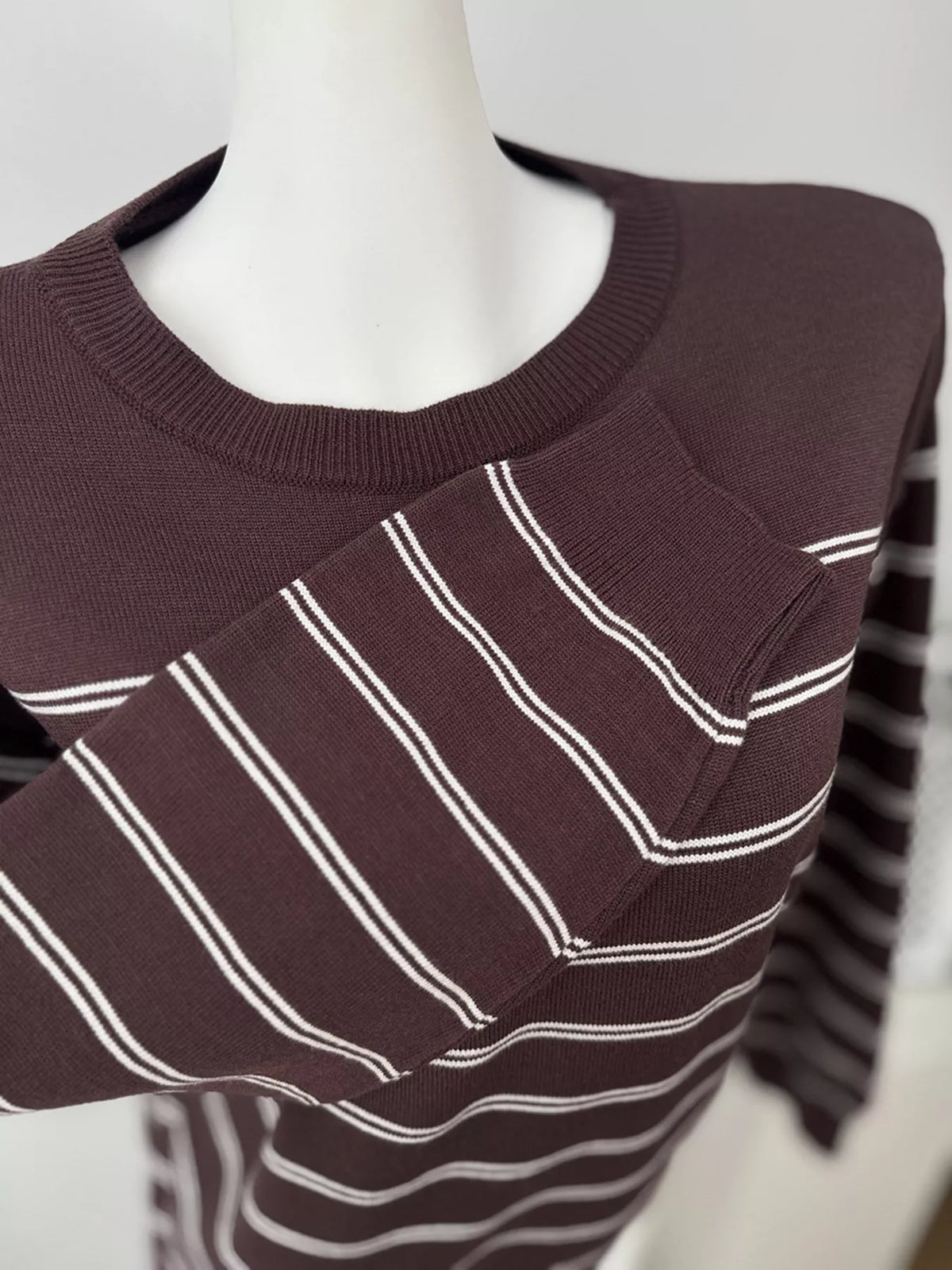 Striped crewneck sweater with layered tie detail in brown, cuff detail