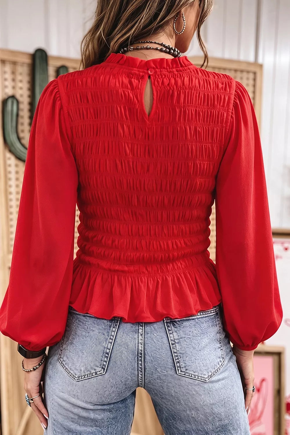 Smocked balloon-sleeve peplum blouse