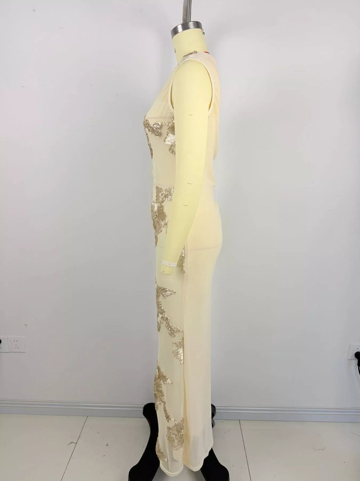 Apricot floral one-shoulder maxi dress, side on mannequin