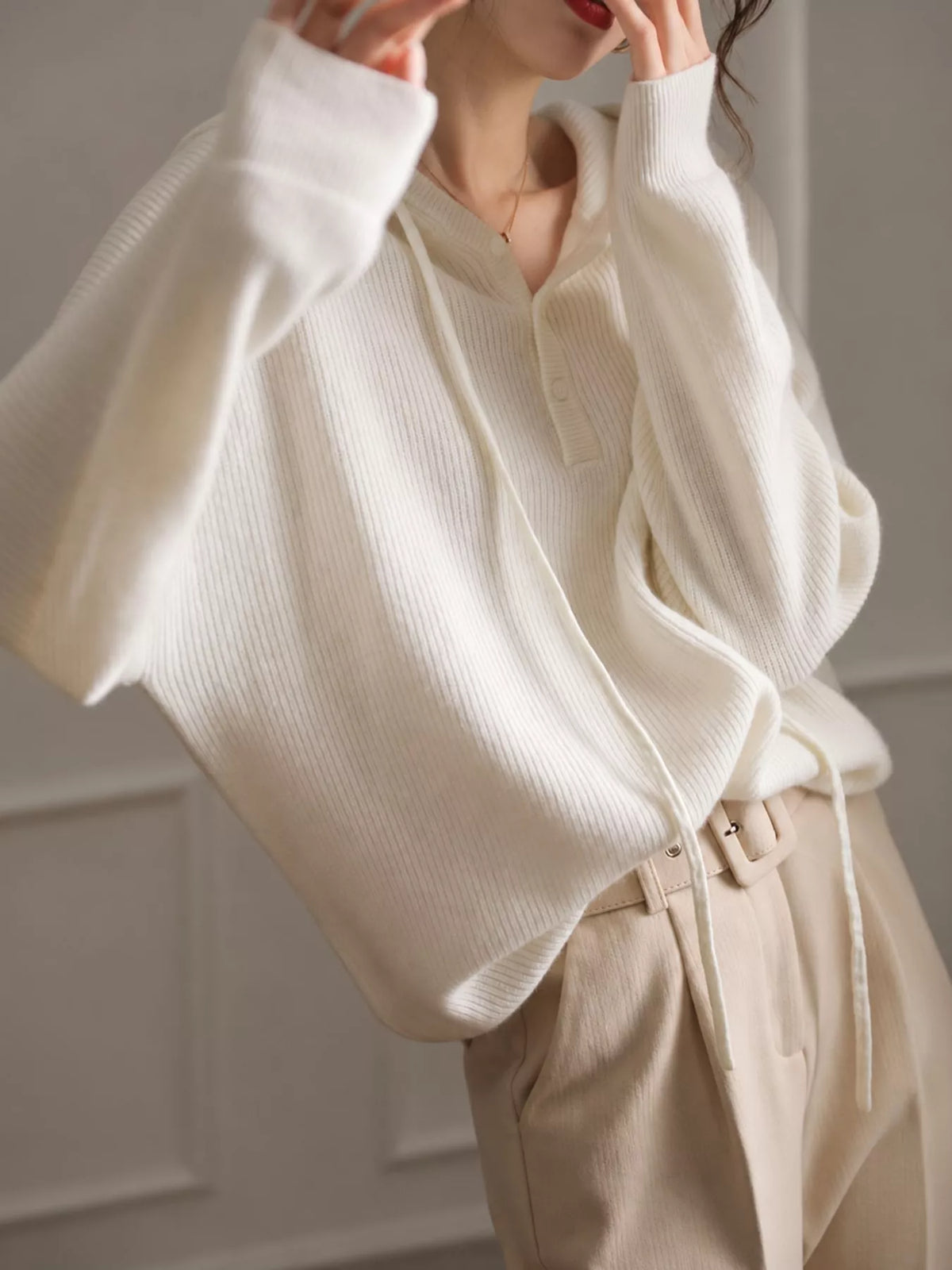 Hooded long sleeve sweater, side view