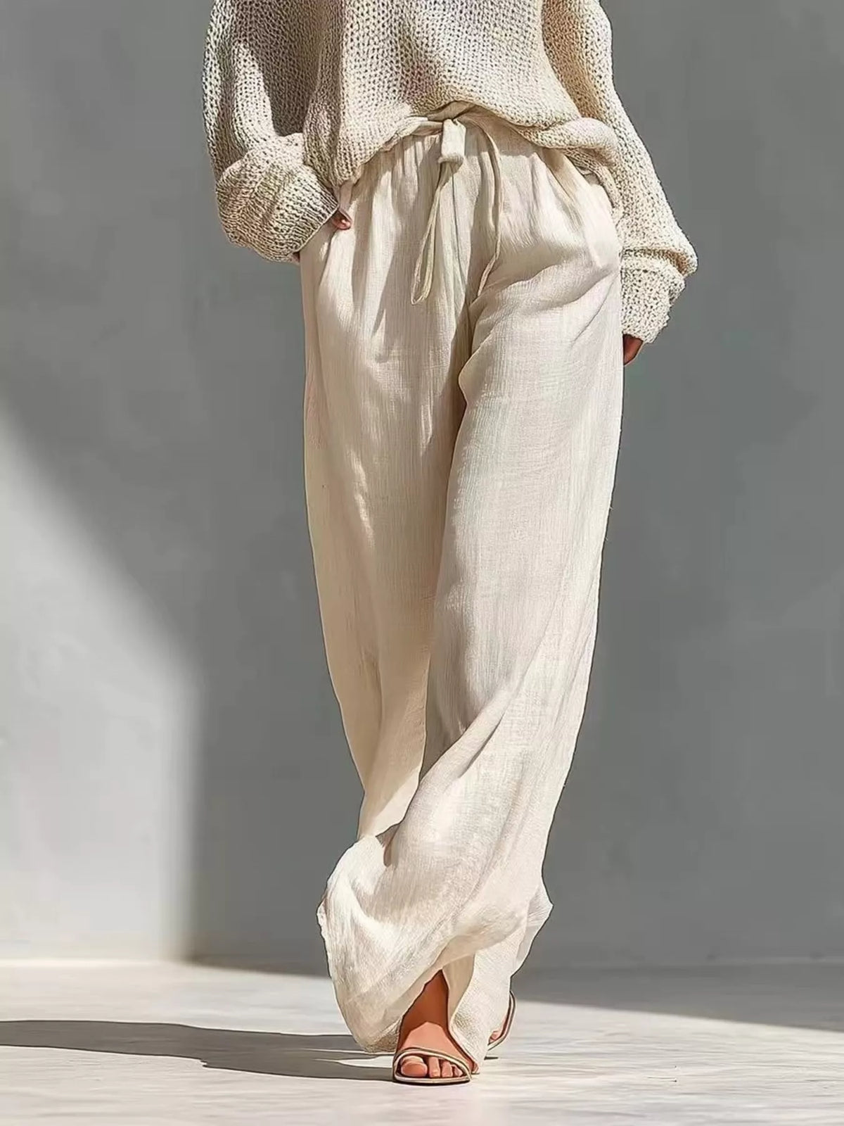 Cream cold-shoulder top and pants set, waist tie and pants detail