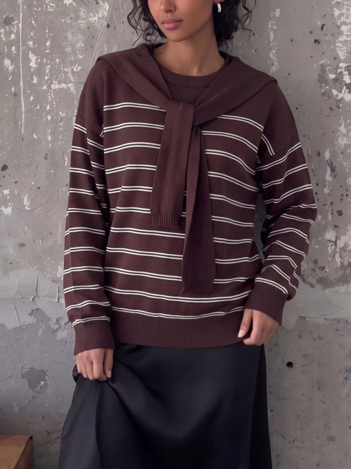 Striped crewneck sweater with layered tie detail in brown, full front view
