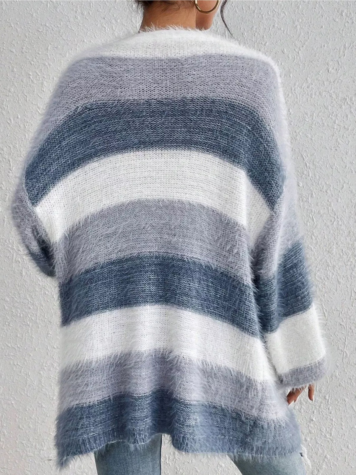 Blue and white striped open-front oversized cardigan, back view.