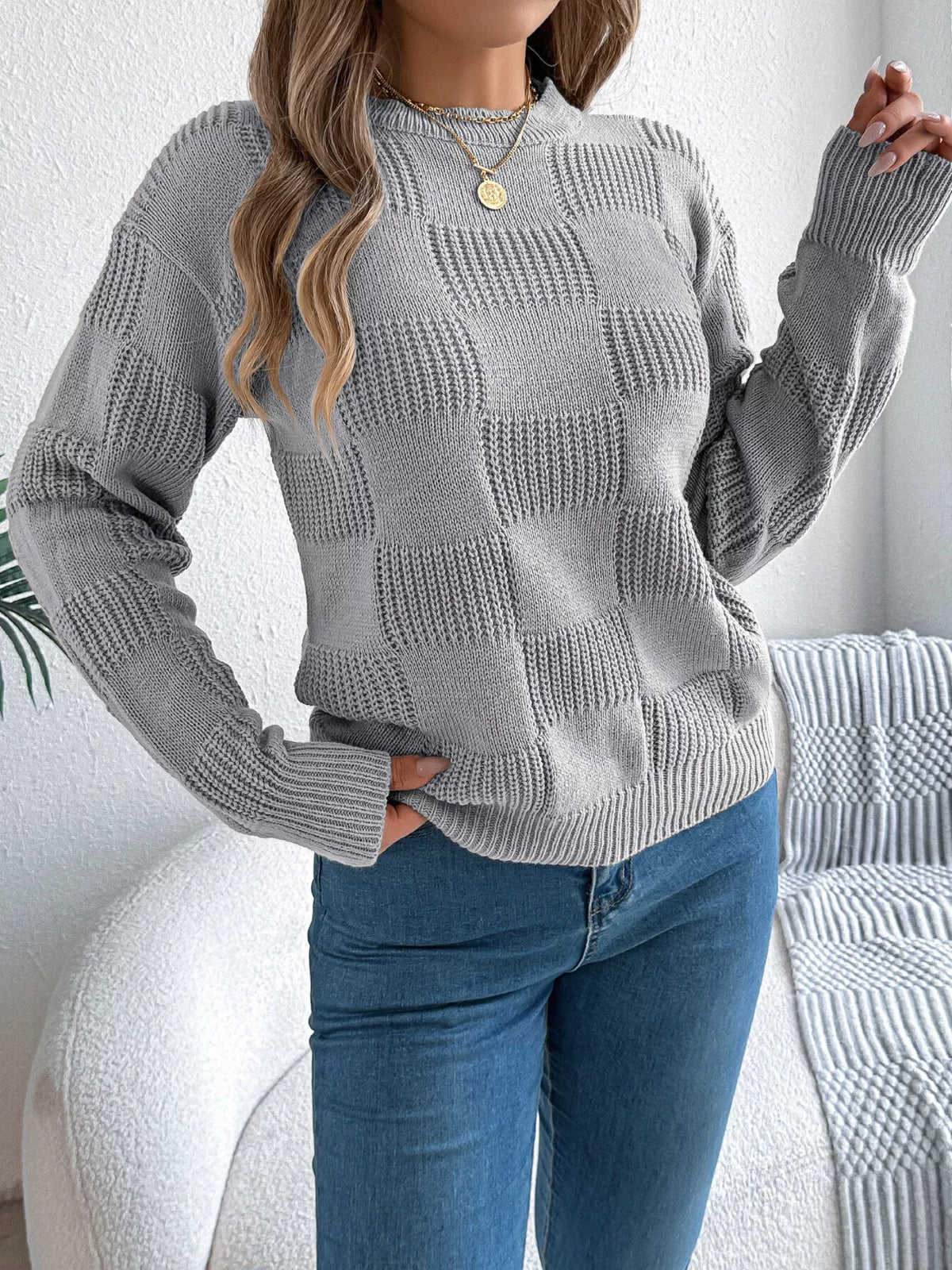 Gray checkerboard textured knit sweater