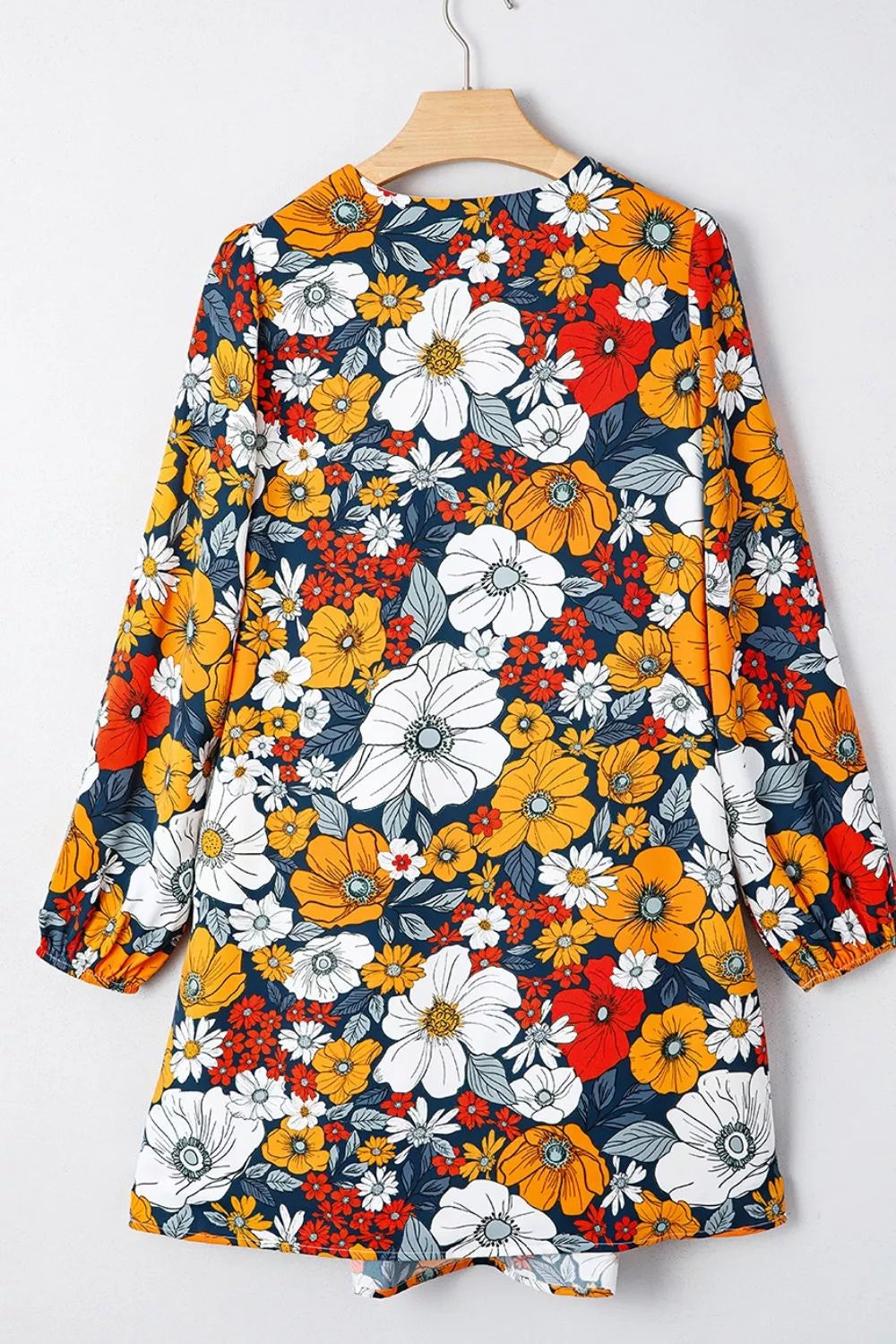Trendsi Boho Floral Print V-Neck Mini Dress with Pockets - Dresses