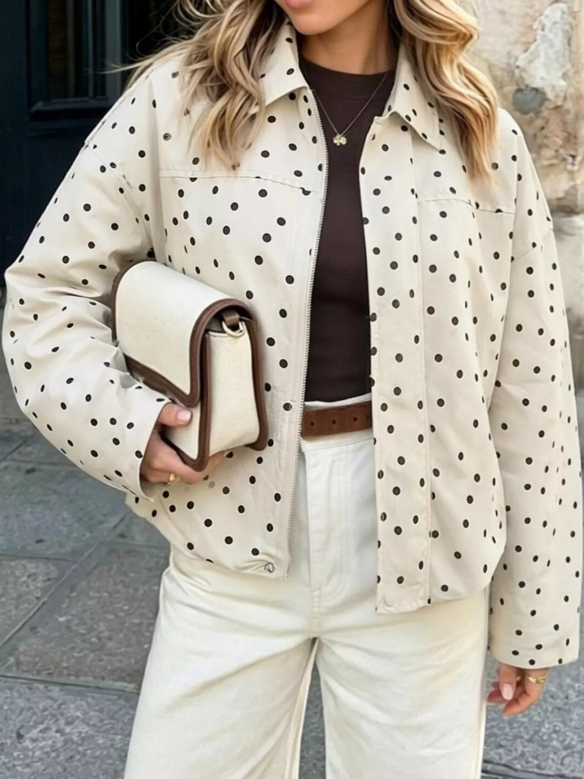 Cream polka dot zip-up jacket — front view