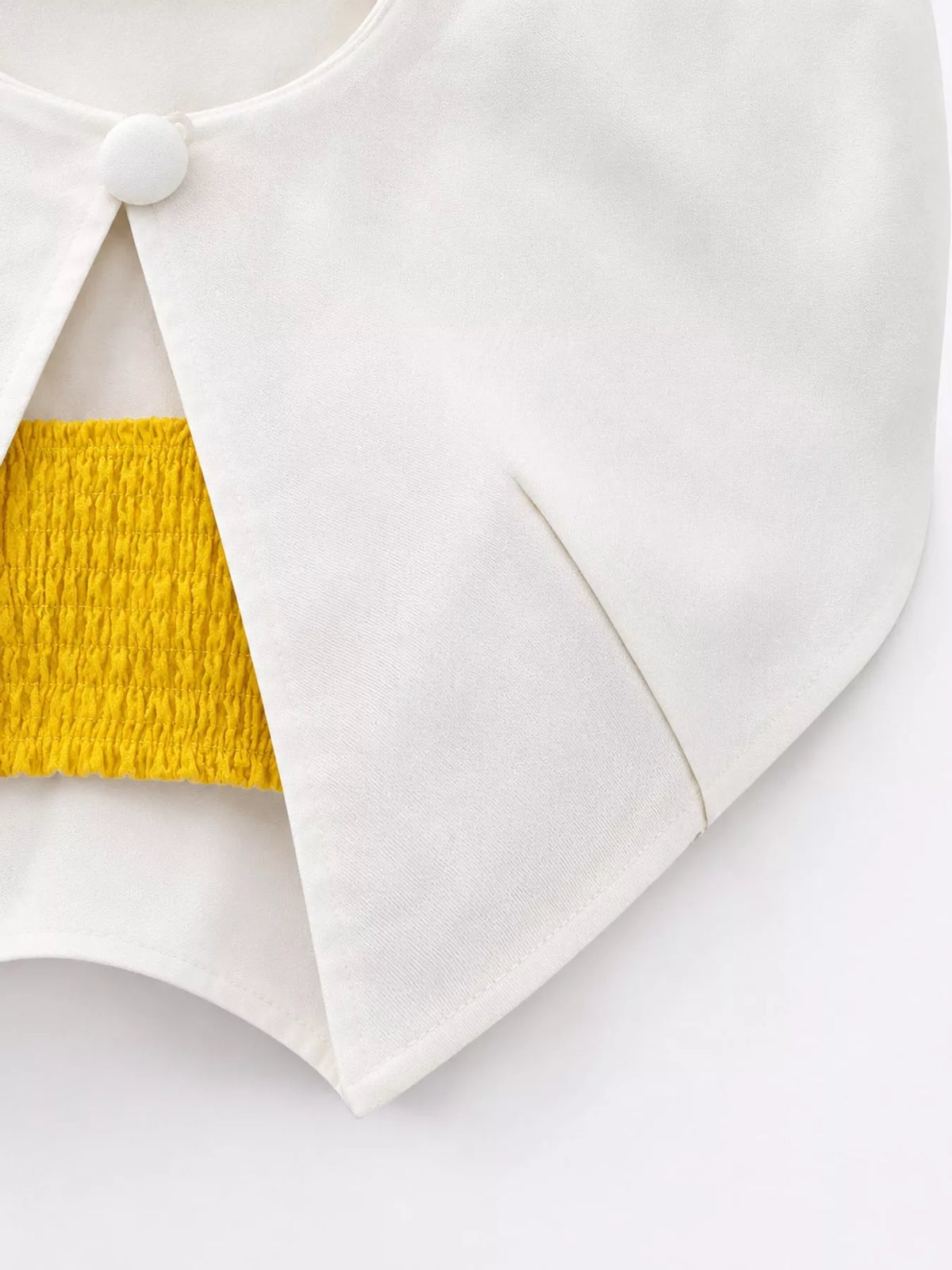 White single button closure cropped cape, detail view