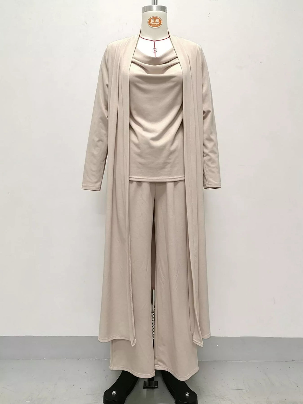 Beige cowl neck top, cardigan and pants set, front view