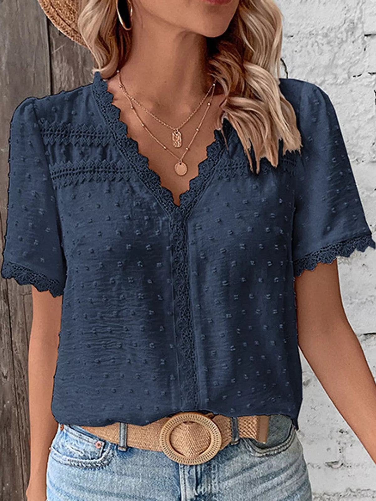 Navy swiss dot v-neck blouse with lace trim