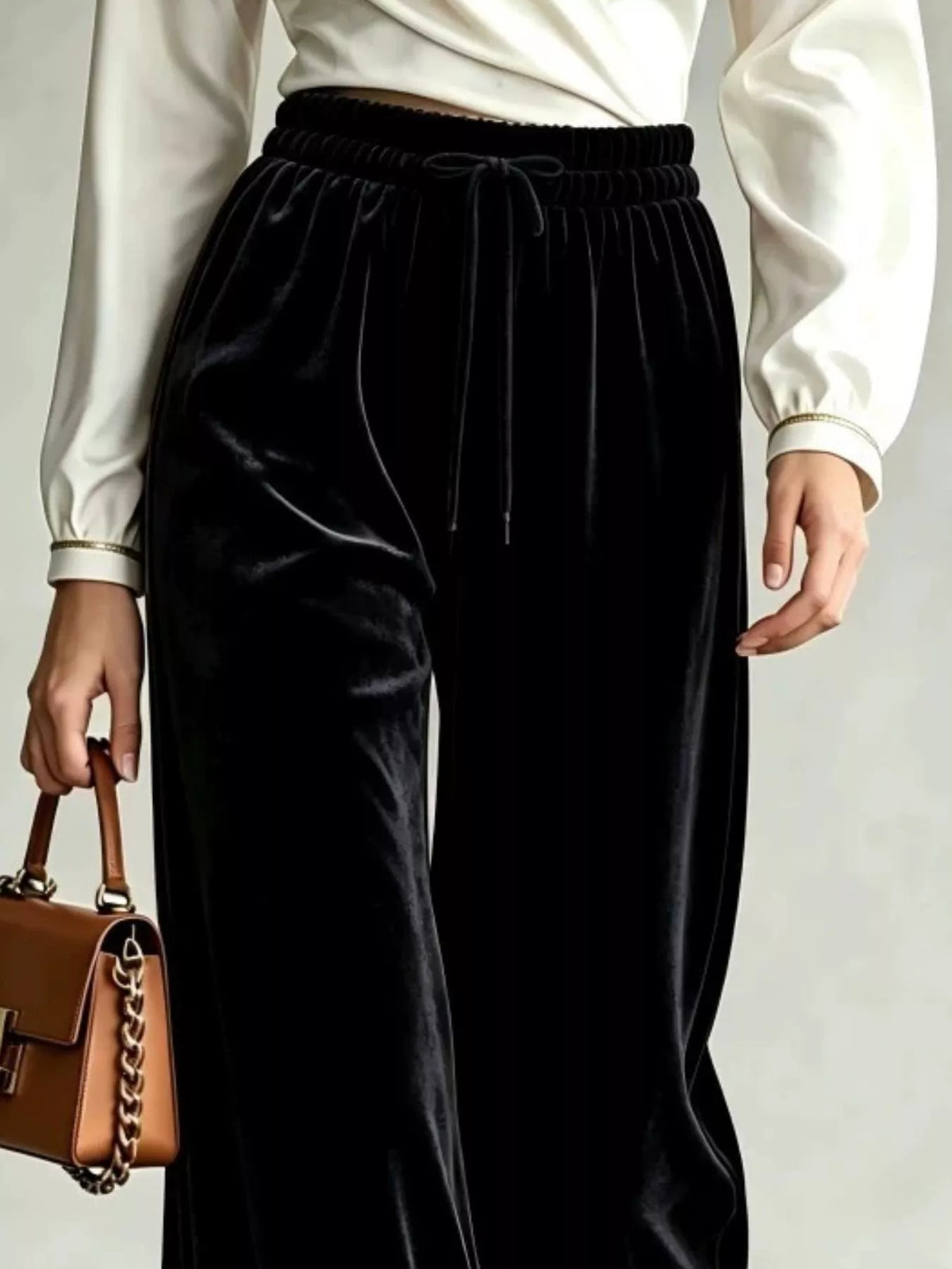 Black wide-leg drawstring velvet pants, waistband detail