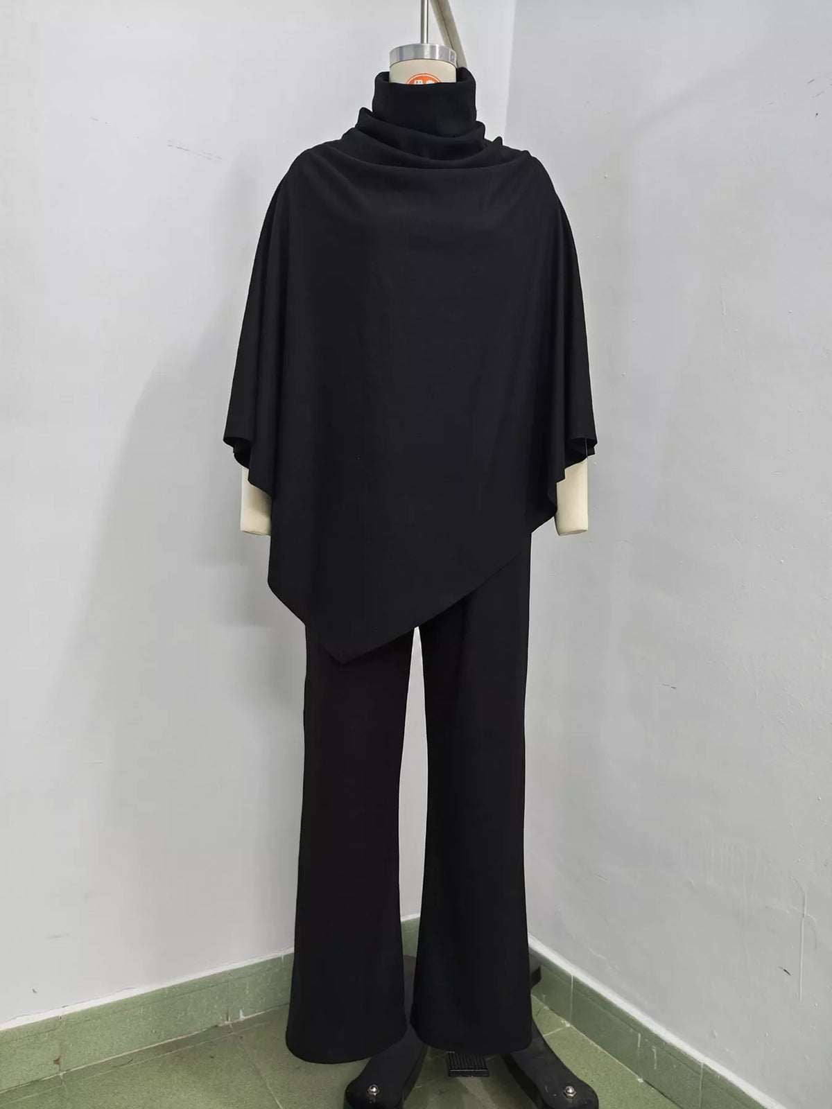 Poncho and pants set, black mannequin front