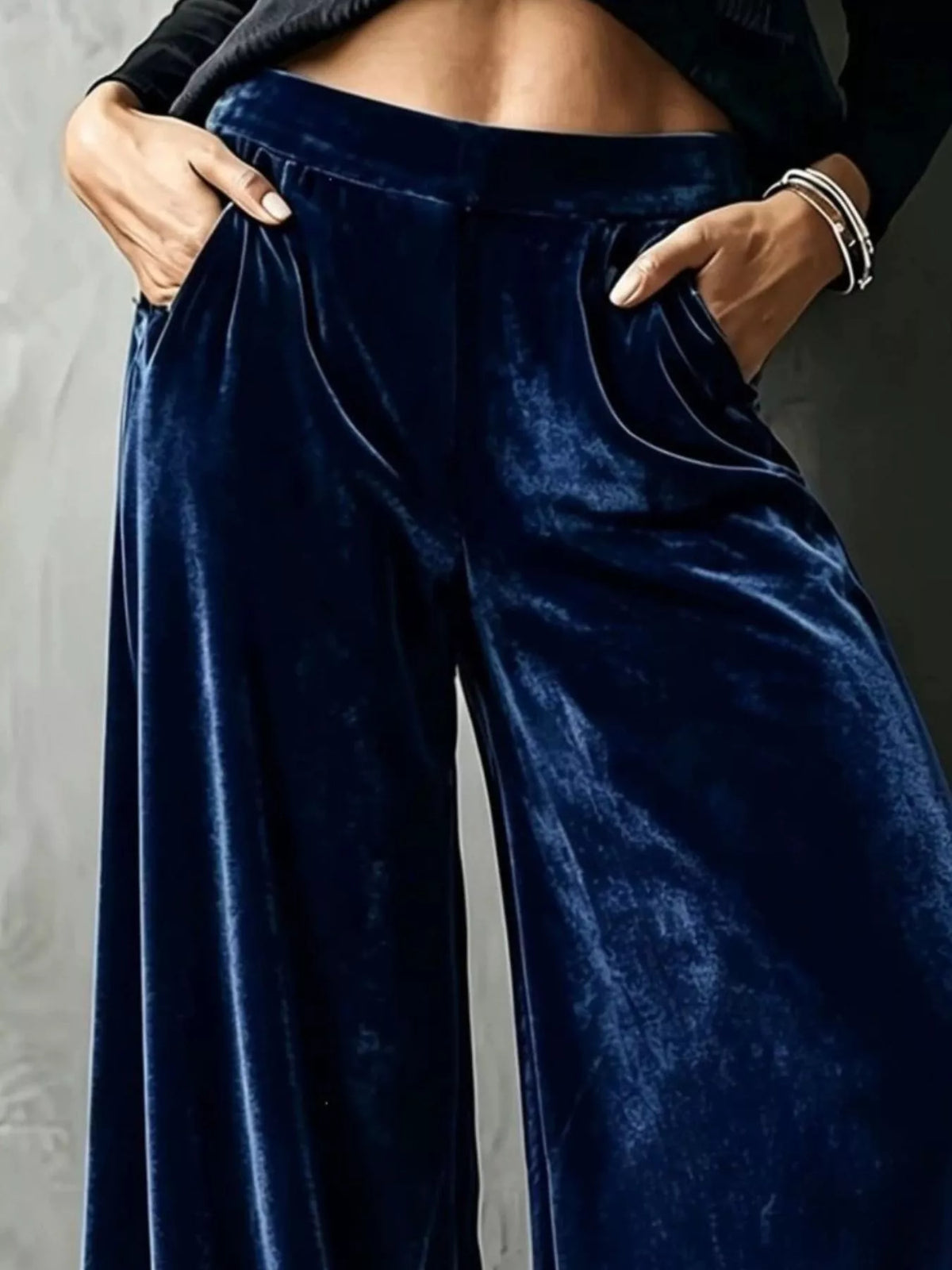 Navy wide-leg velvet pants, waist and pocket detail