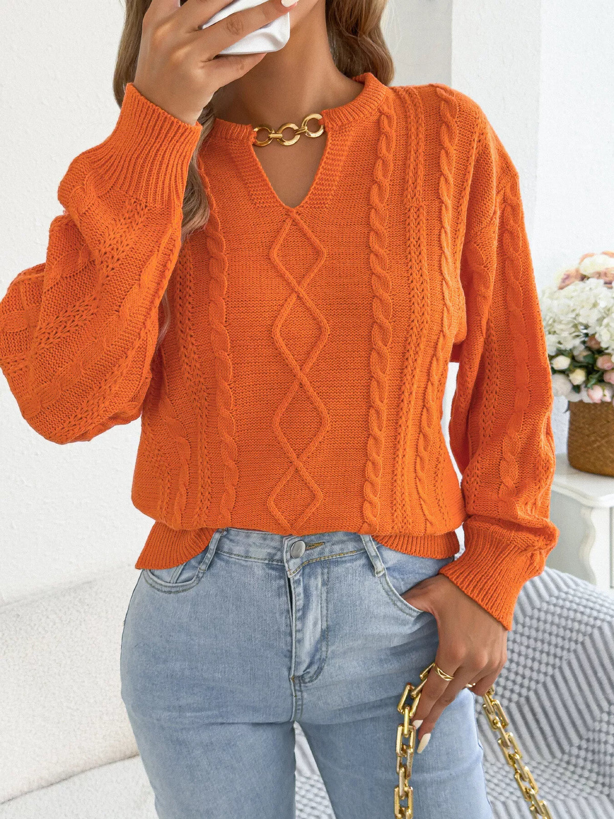 Orange cable knit notched sweater