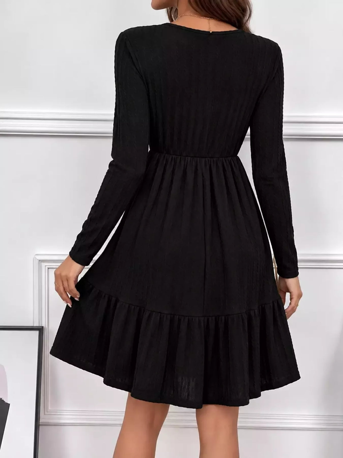 Long Sleeve Ruffle Hem Mini Dress, back view in black